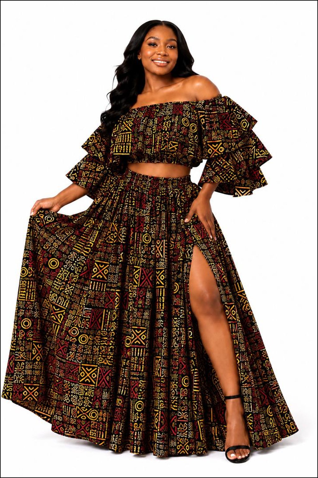 Women Wearing An African Print Off‑Shoulder Two‑Piece Set, Red, Yellow & Green Ankara Crop Top & Maxi Skirt