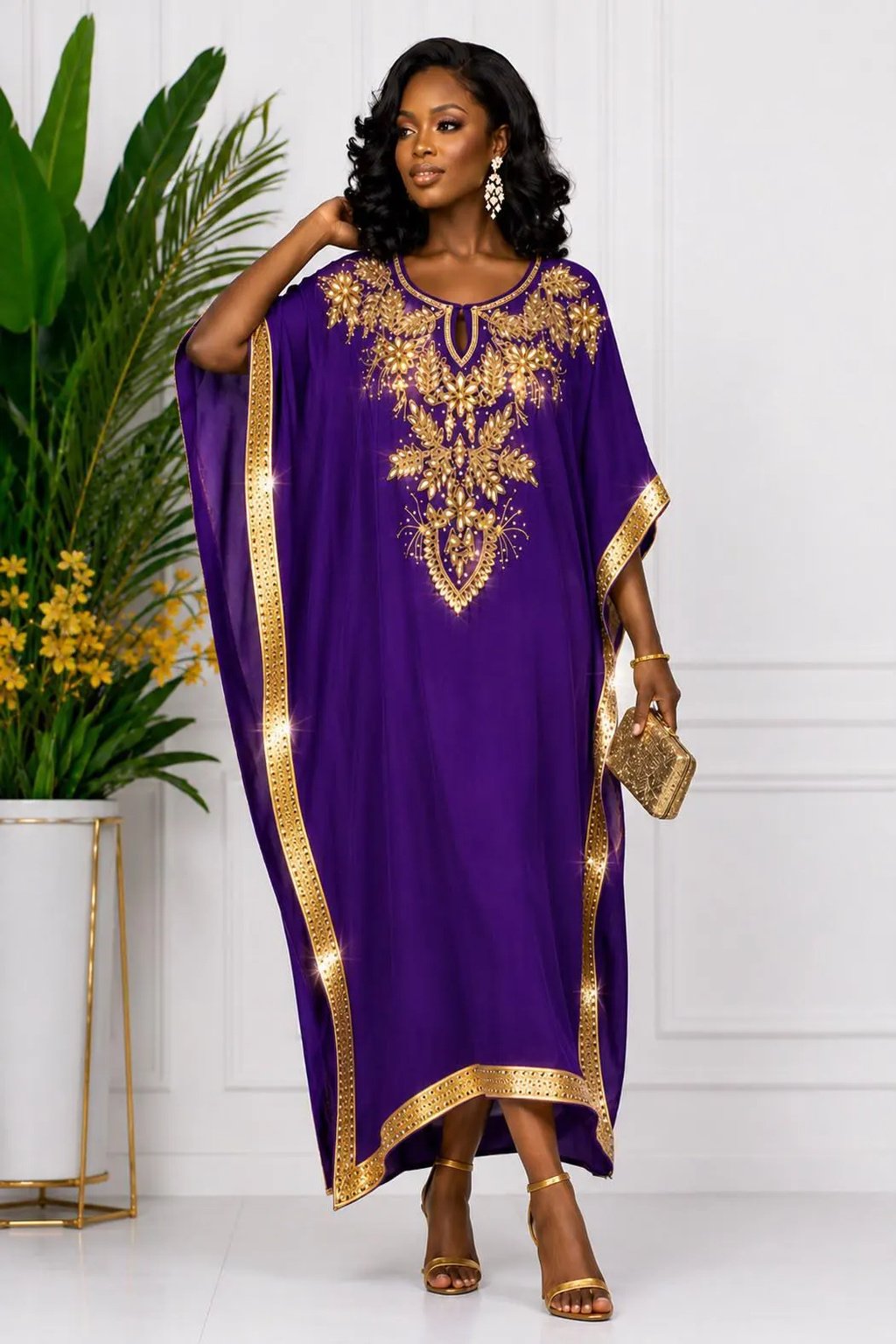 A Woman Wearing A Luxury Royal Purple And Gold Embroidery Kaftan Dress and Boubou Gown.