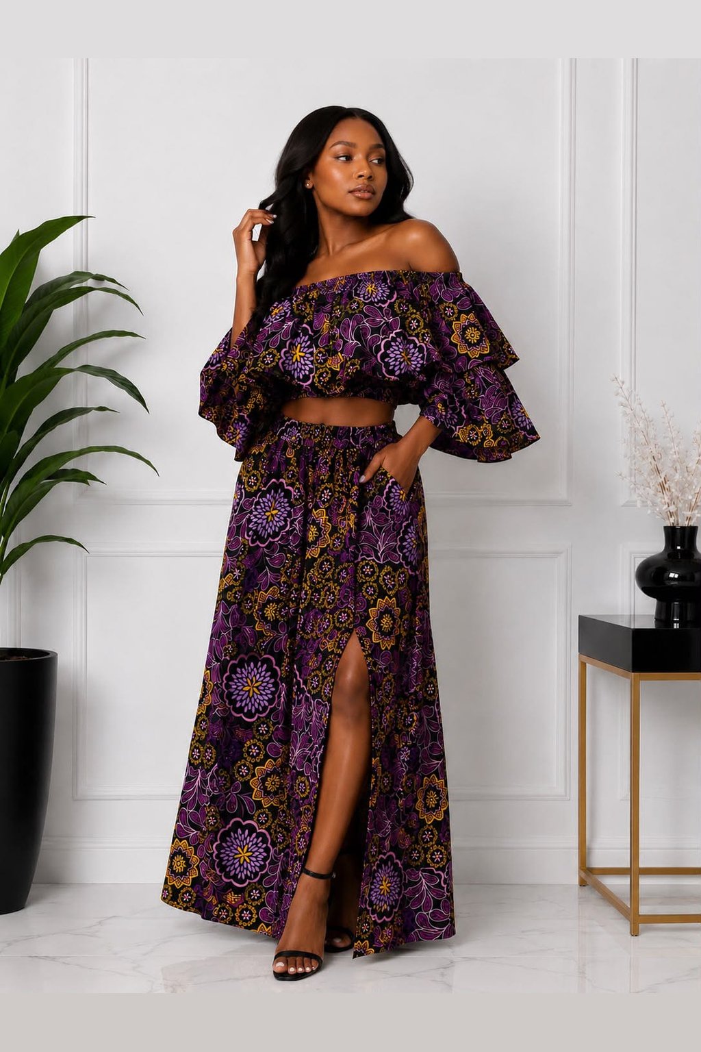 Woman Wearing An African Print Off‑Shoulder Two‑Piece Set, Purple Ankara Crop Top & Maxi Skirt.