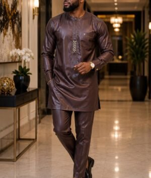 A Man Wearing A Chocolate Brown & Golden Bronze Geometric Chevron Senator Tunic And Tailored Pants Set.