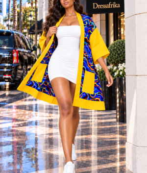 A Woman Wearing A Yellow African Kimono Jacket, Bright Abstract Blue Cardigan And Open Front Summer Duster Coat.