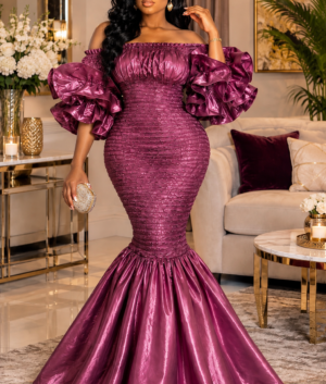 A Woman Wearing A Luminous Elastic Metallic Plum Smocked Peplum Ruffle Mermaid Gown.
