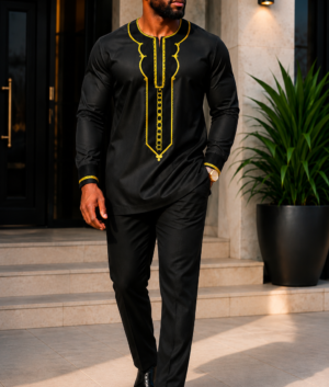 A Man Wearing An Obsidian Black & Gold Geometric Embroidered Senator Tunic And Tailored Pants Set.