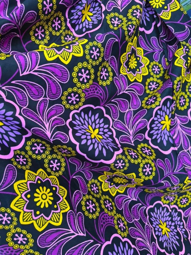 Royal Violet Smocked Off-Shoulder Ruffle Ankara Maxi Gown (With / Without Slit Options) 5 A Woman Wearing A Royal Violet Smocked Off-Shoulder Ruffle Ankara Maxi Gown (With / Without Slit Options)