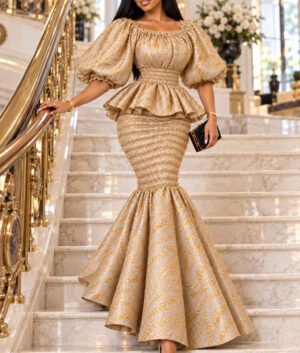 A Woman Wearing A Gilded Elastic Gold Metallic Jacquard Smocked Peplum Mermaid Gown.