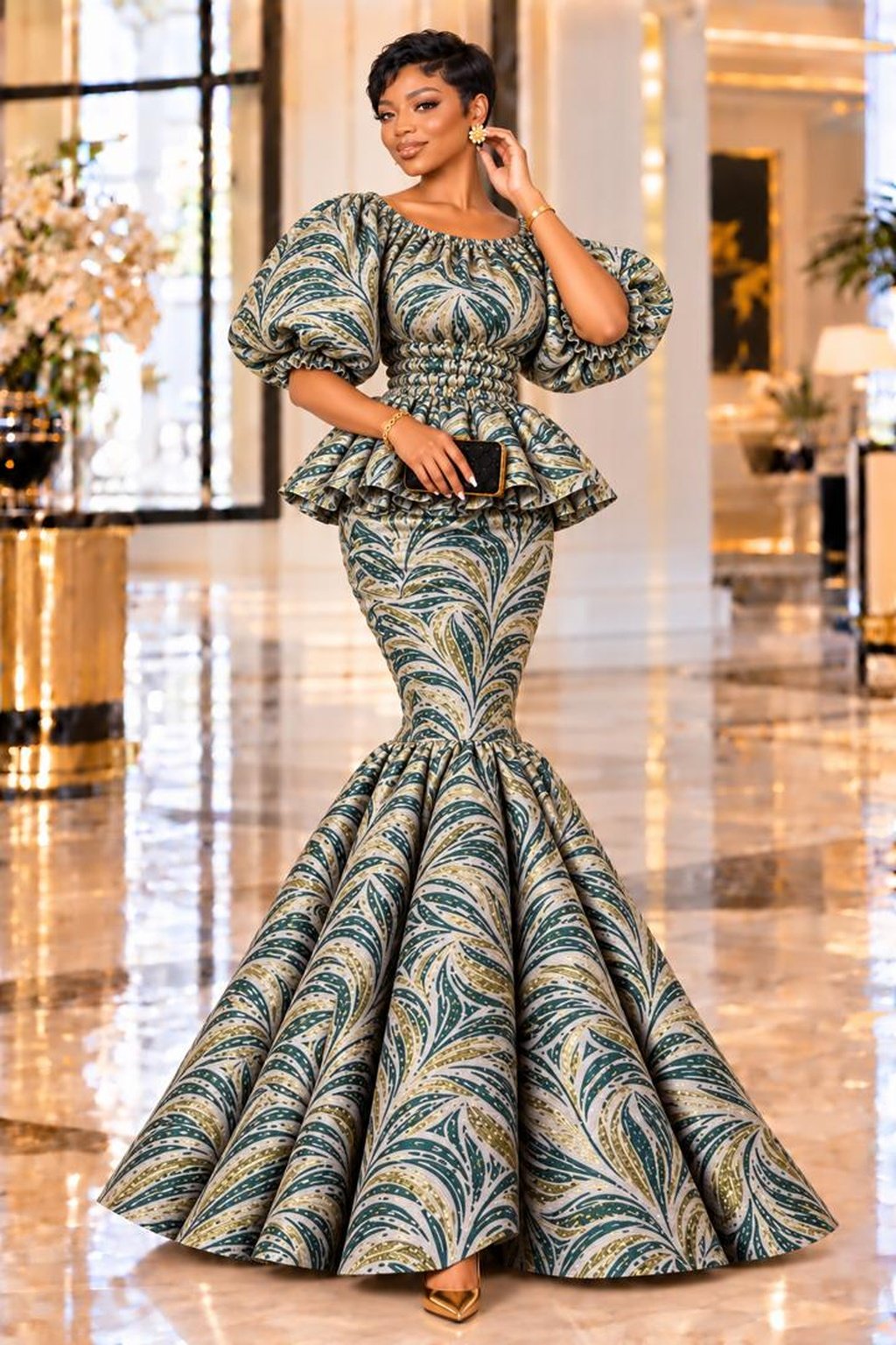 A Woman Wearing An Emerald Elastic Green & Gold Metallic Jacquard Smocked Peplum Mermaid Gown.