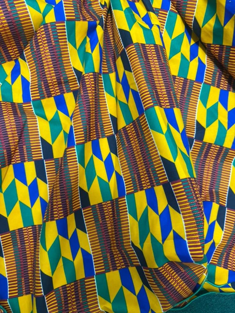Heritage Kente Print Mermaid Midi Dress. 4 A Woman Wearing A Heritage Kente Print Mermaid Midi Dress.