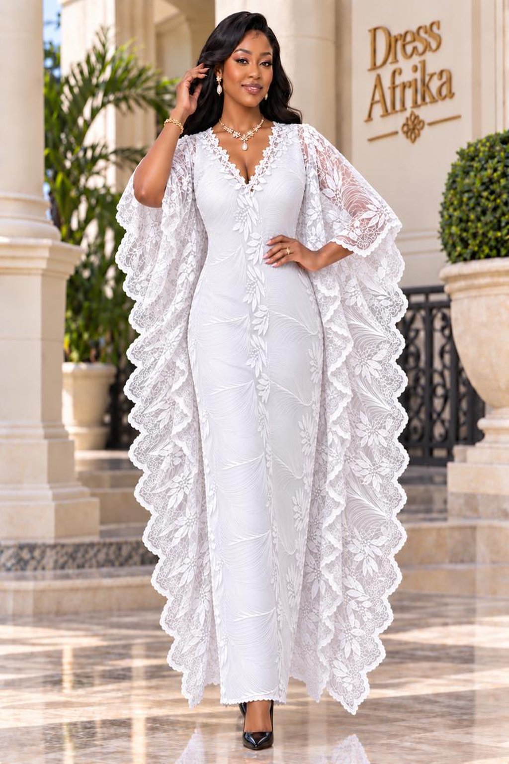 A Woman Wearing A Luxury White French Lace Boubou Kaftan With A Bridal Satin Inner Gown.