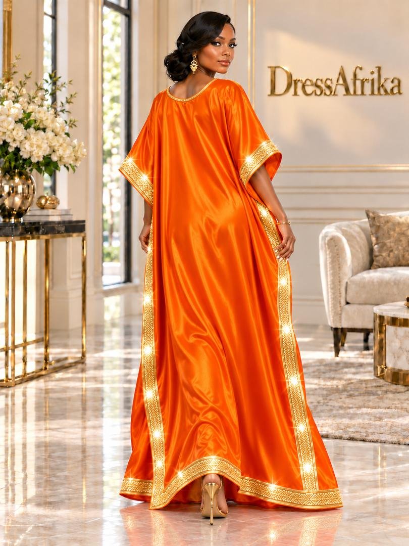 Empress Tangerine Silk Boubou Kaftan & Gold Crystal Medallion Gown. 3 A Woman Wearing An Empress Tangerine Silk Boubou Kaftan & Gold Crystal Medallion Gown.