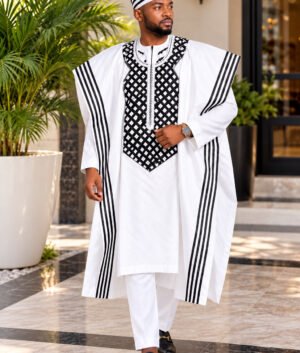 A Man Wearing A Royal Alabaster 4-Piece Embroidered Agbada And Long-Sleeve Senator Suit Set With Hat.