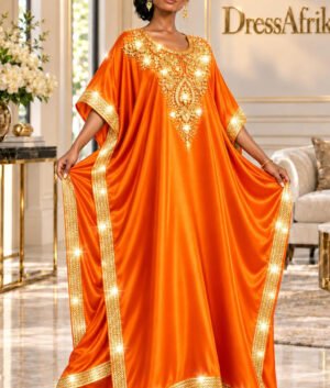 A Woman Wearing An Empress Tangerine Silk Boubou Kaftan & Gold Crystal Medallion Gown.
