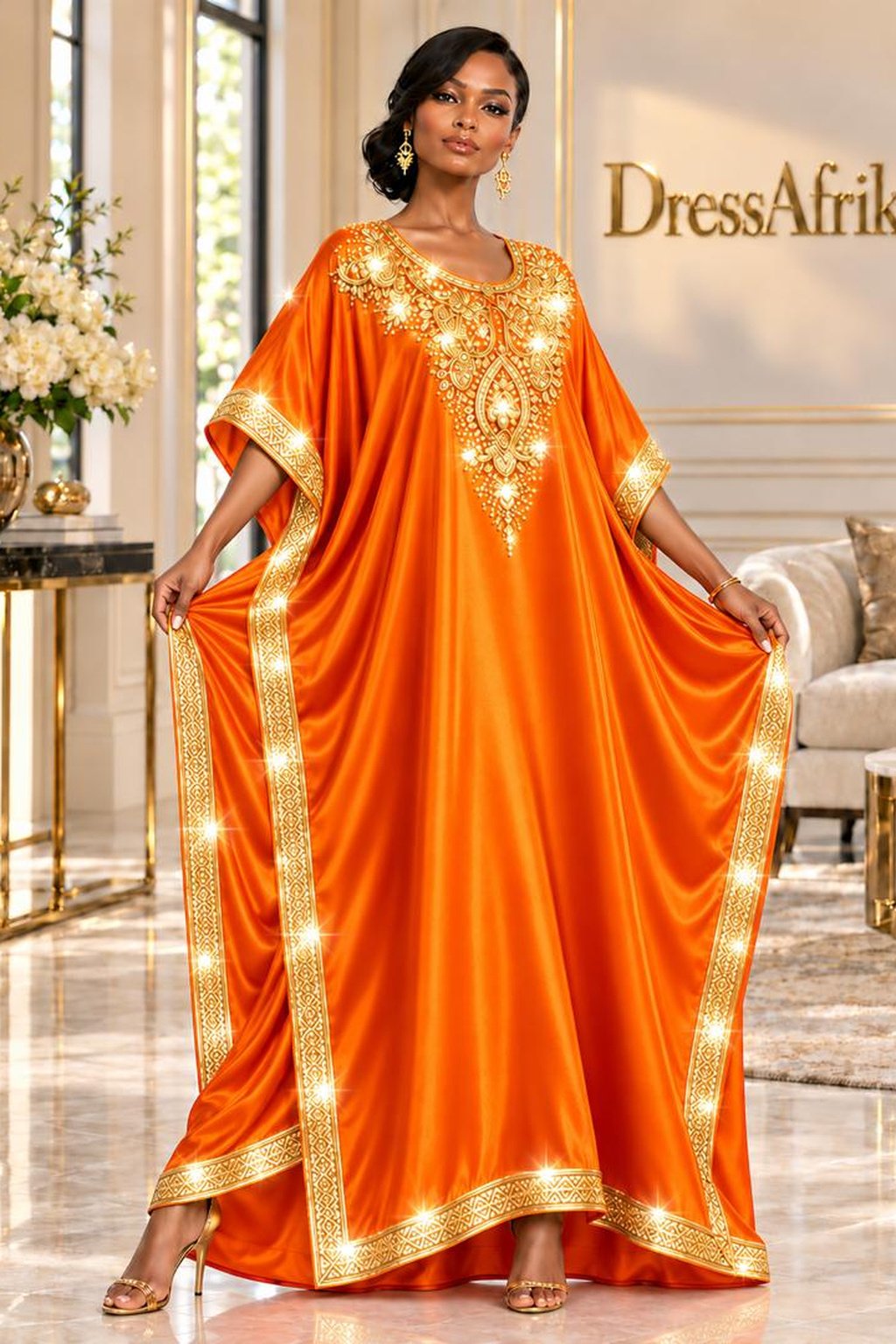 A Woman Wearing An Empress Tangerine Silk Boubou Kaftan & Gold Crystal Medallion Gown.